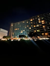 front of the hotel at night from the beach