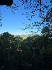 Standing near hot tub.