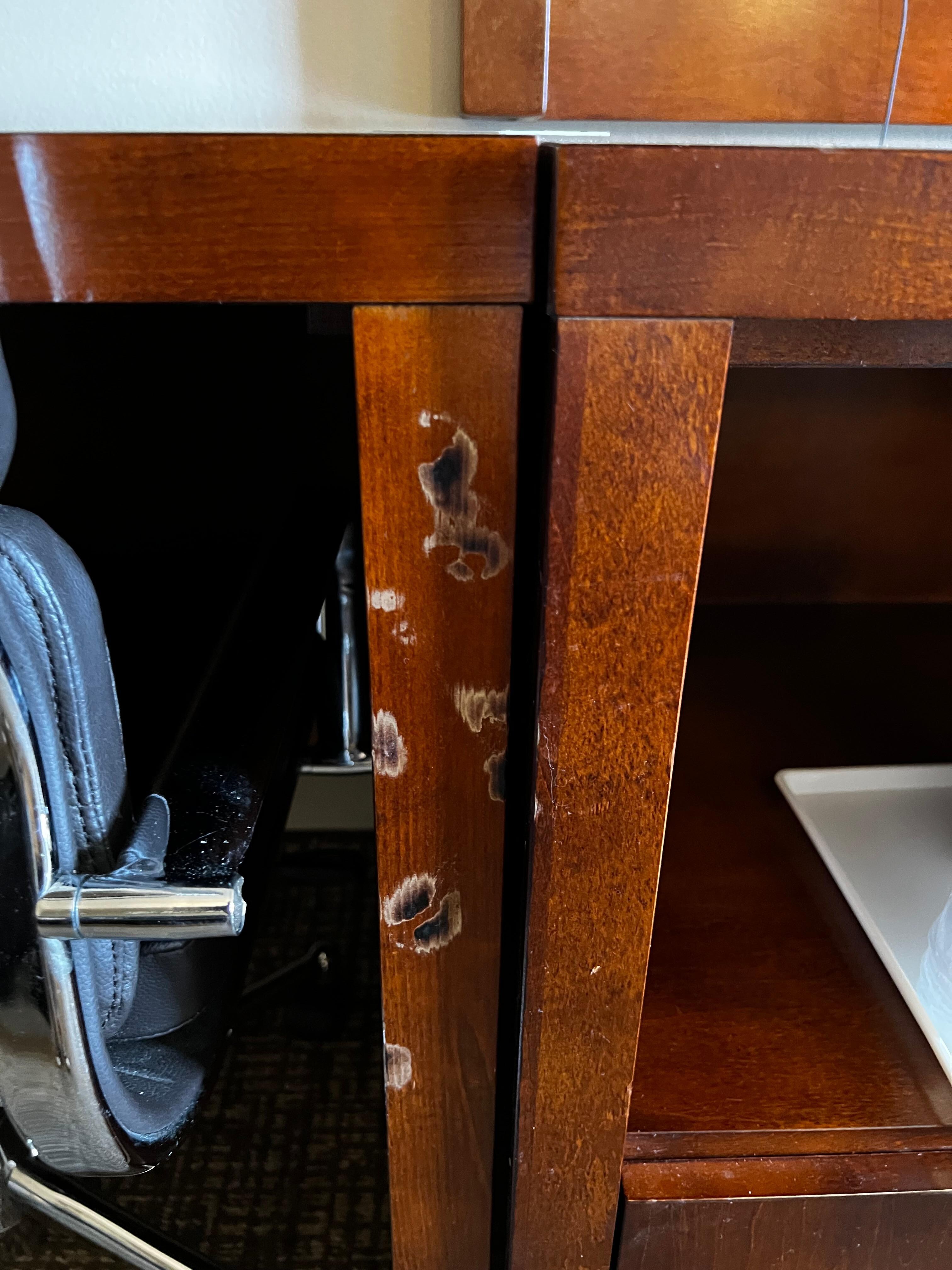 Cigarette burns on the furnishings.
