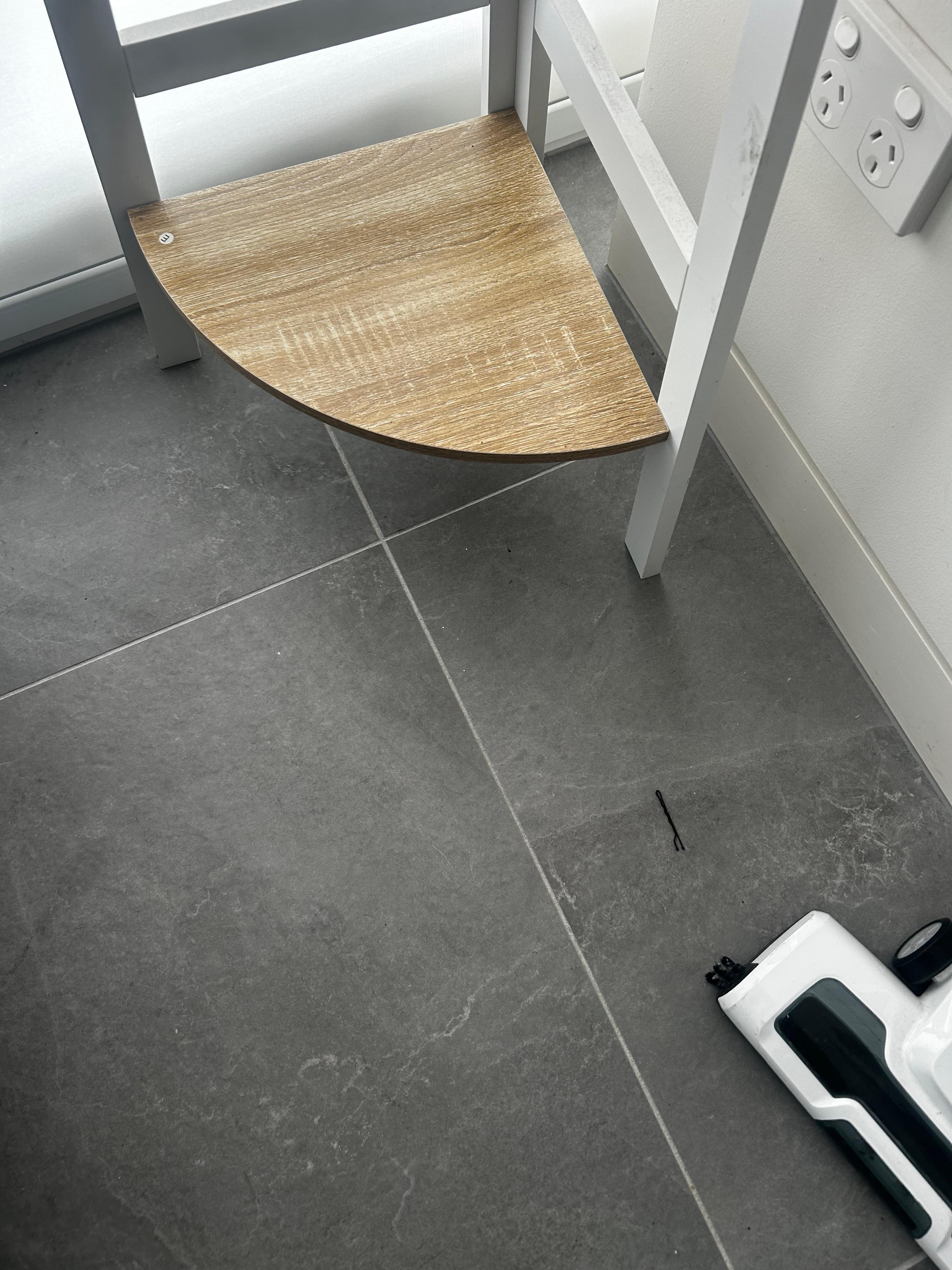 Bobby pin on in vacuumed floor