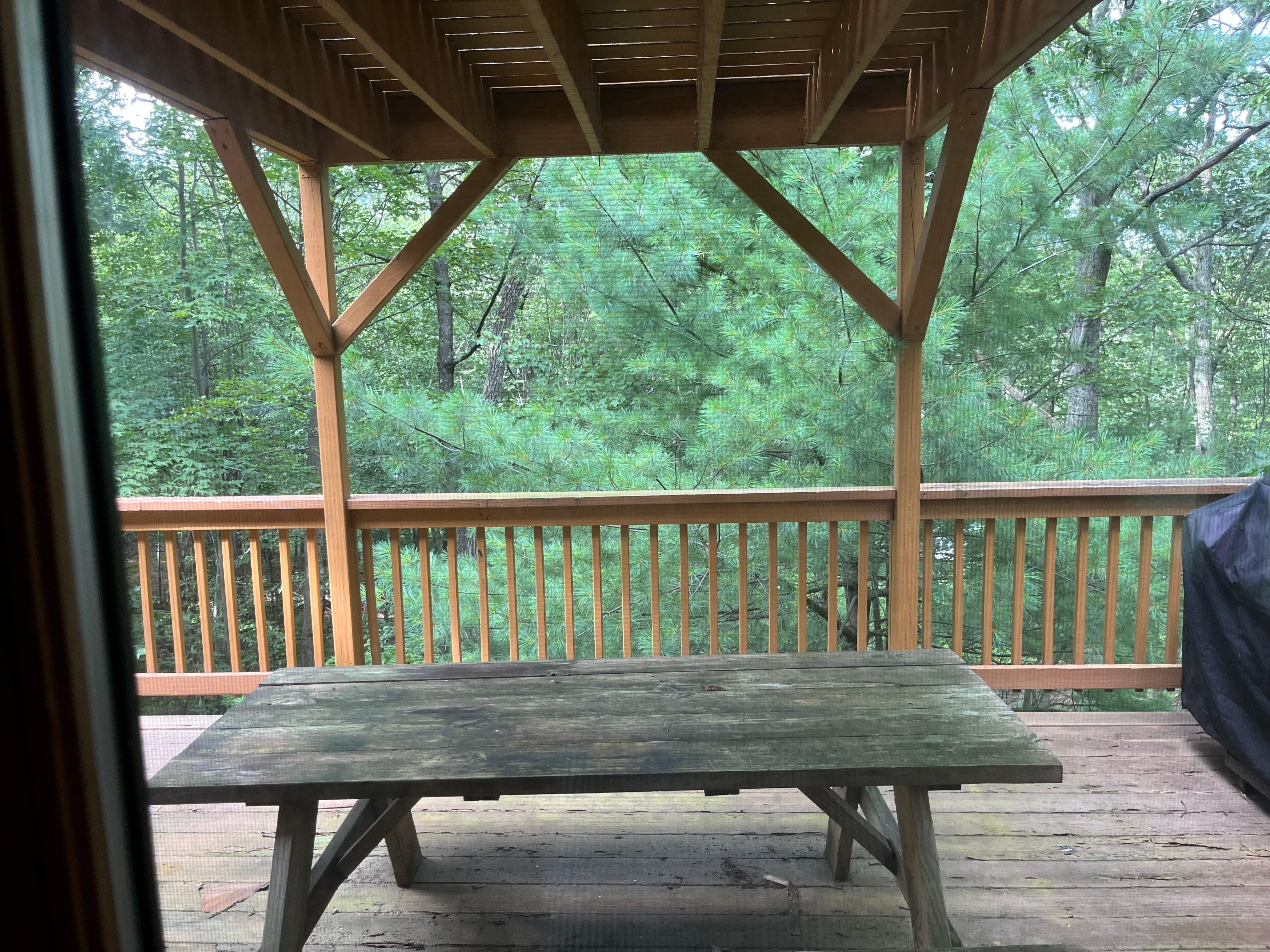 Picnic table on second floor deck. 