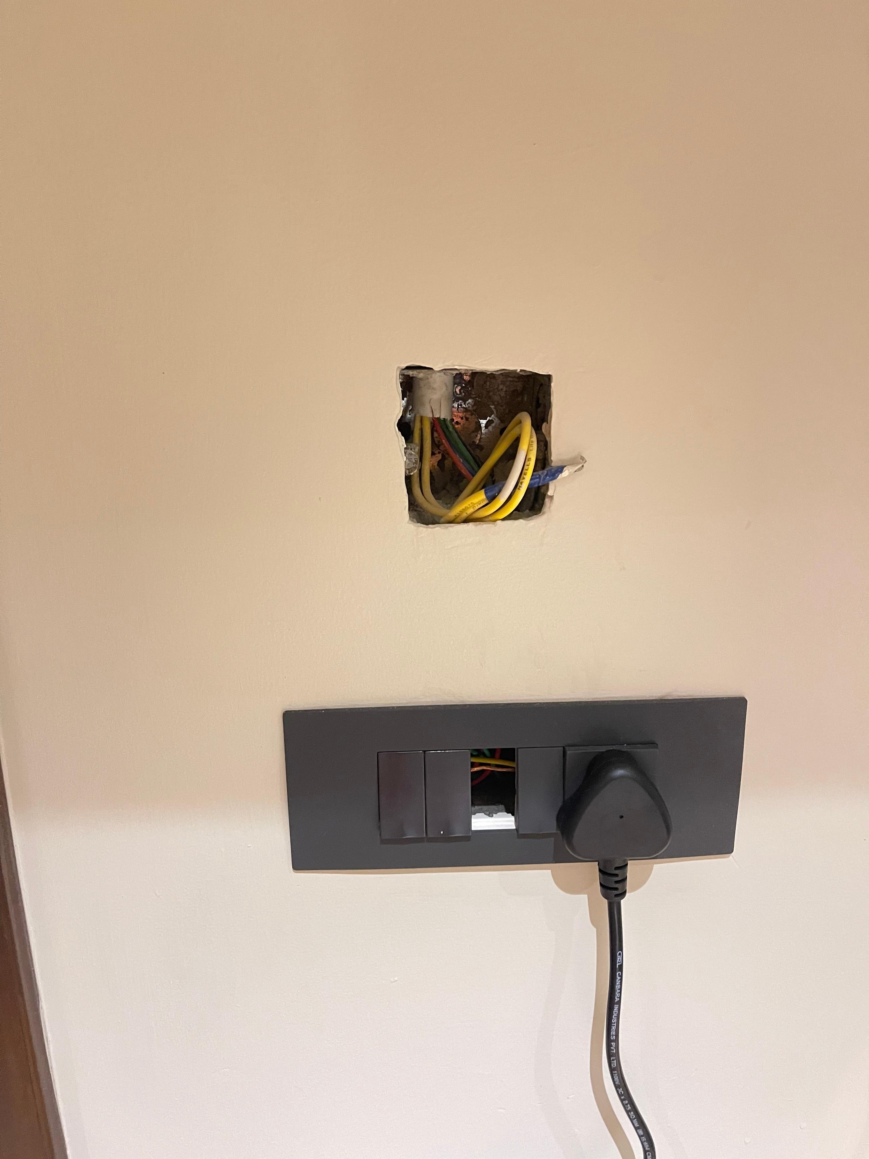 No AC or Wifi in room. Incomplete electrical work in room. Exposed wires posing electrocution risk