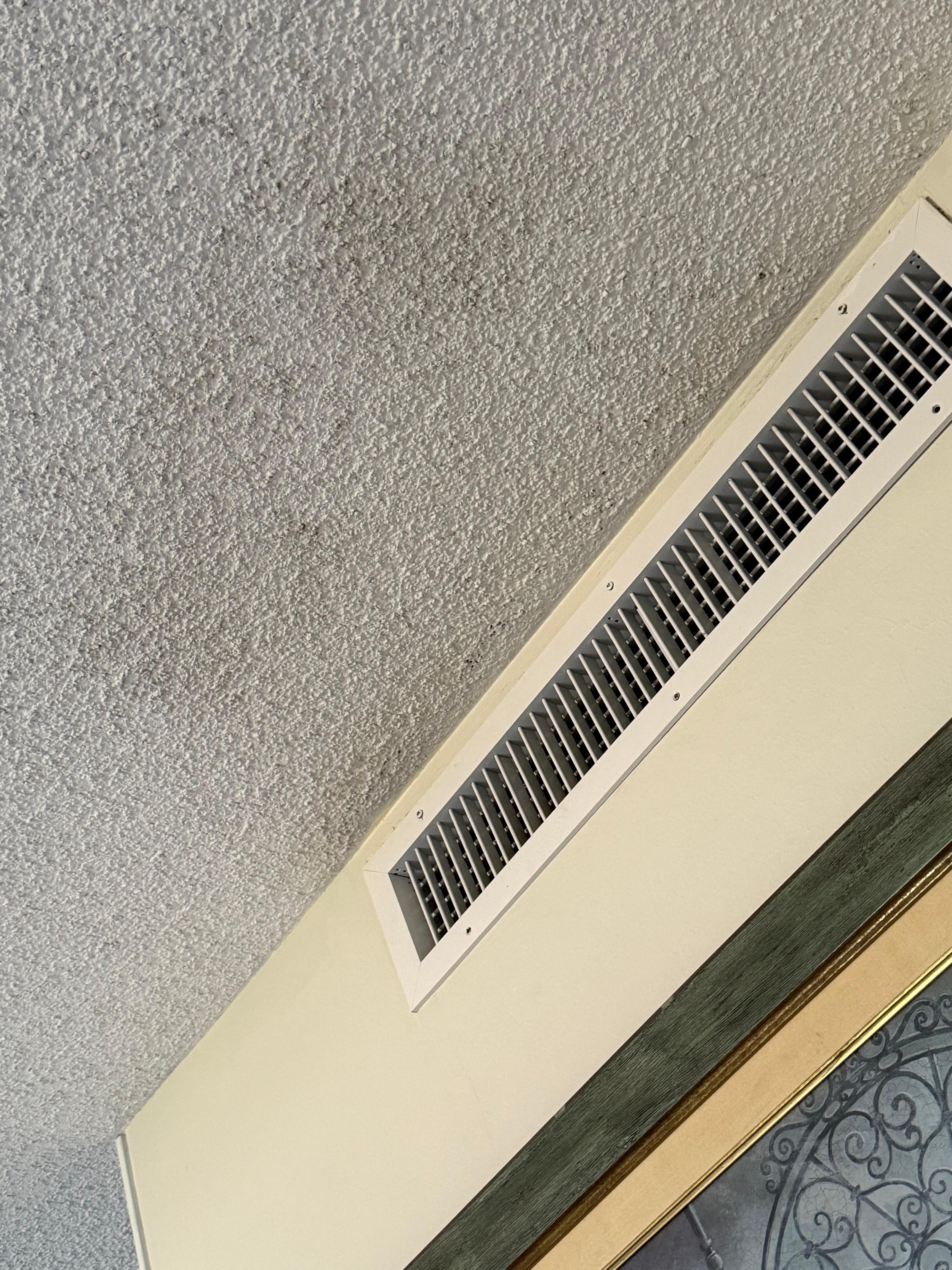 Blackened ceiling in front of AC vent 
