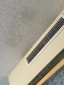 Blackened ceiling in front of AC vent