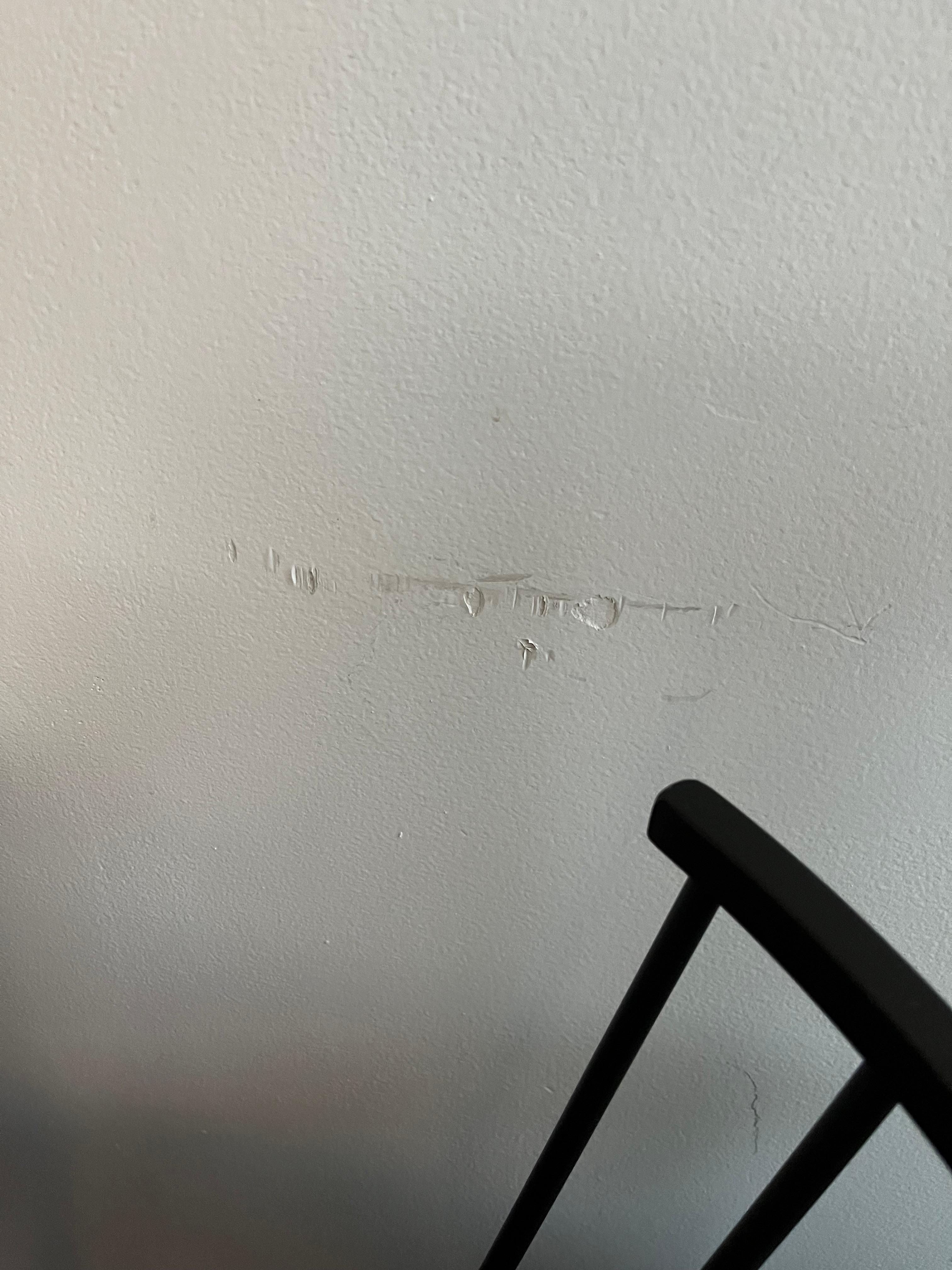 Damaged wall at kitchen bar