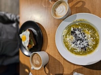 Eggs in green salsa with black beans.