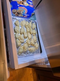 Homemade Pierogis being frozen for happy bellies later.