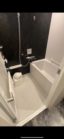 The whole room was a bath and shower room. Outside had a sink for washing hands.