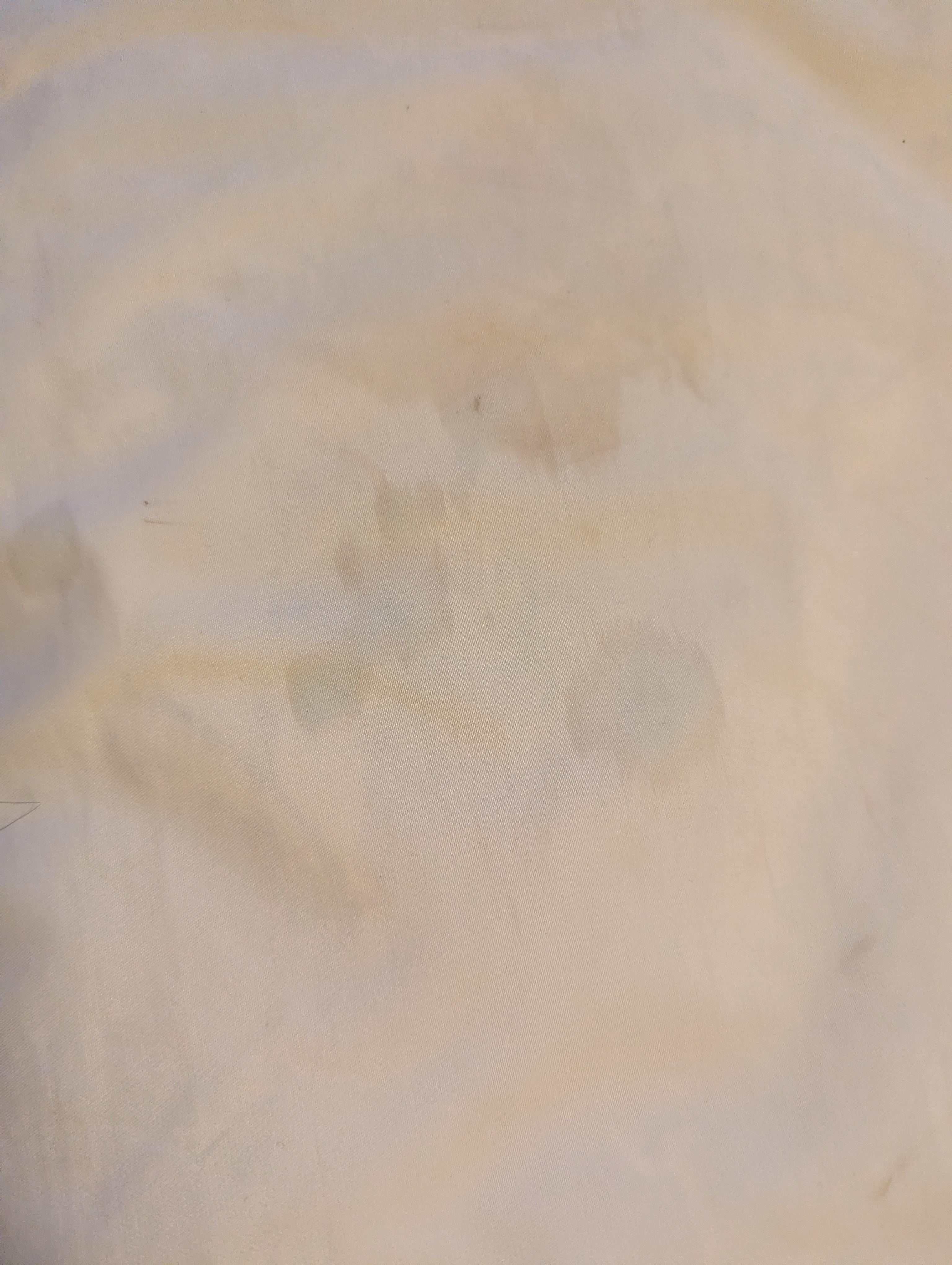 Worn thin mattress with dirty mattress cover 