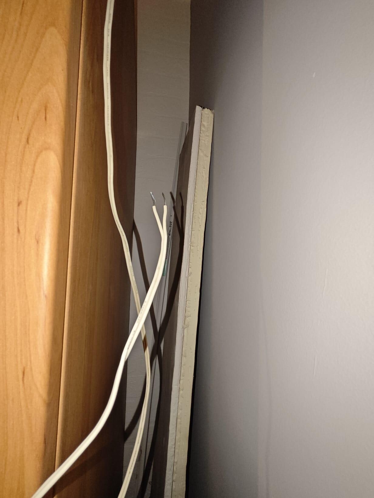 Plaster board loose wiring  in one of the bedrooms 