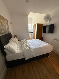 Picture taken from Front Door. Only a 4” Bed and no bedside table this this side of the bed