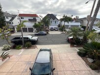 Cars parked on each side of driveway apron