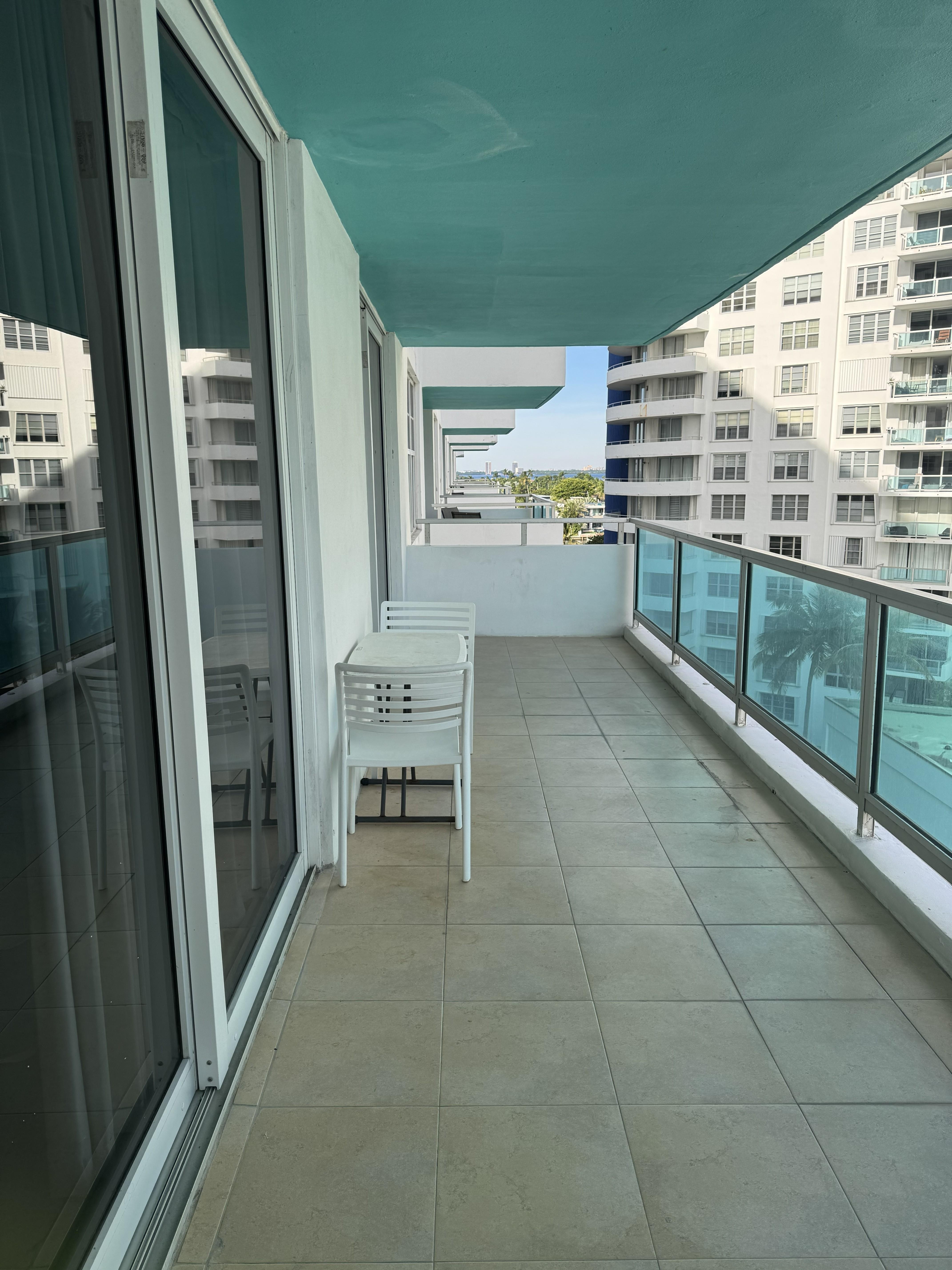 Balcony on the side, between buildings.