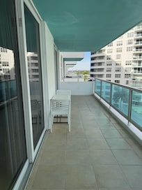 Balcony on the side, between buildings.