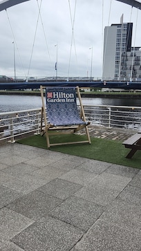 Back of hotel. Plenty of seating. Just loved the big deck chair