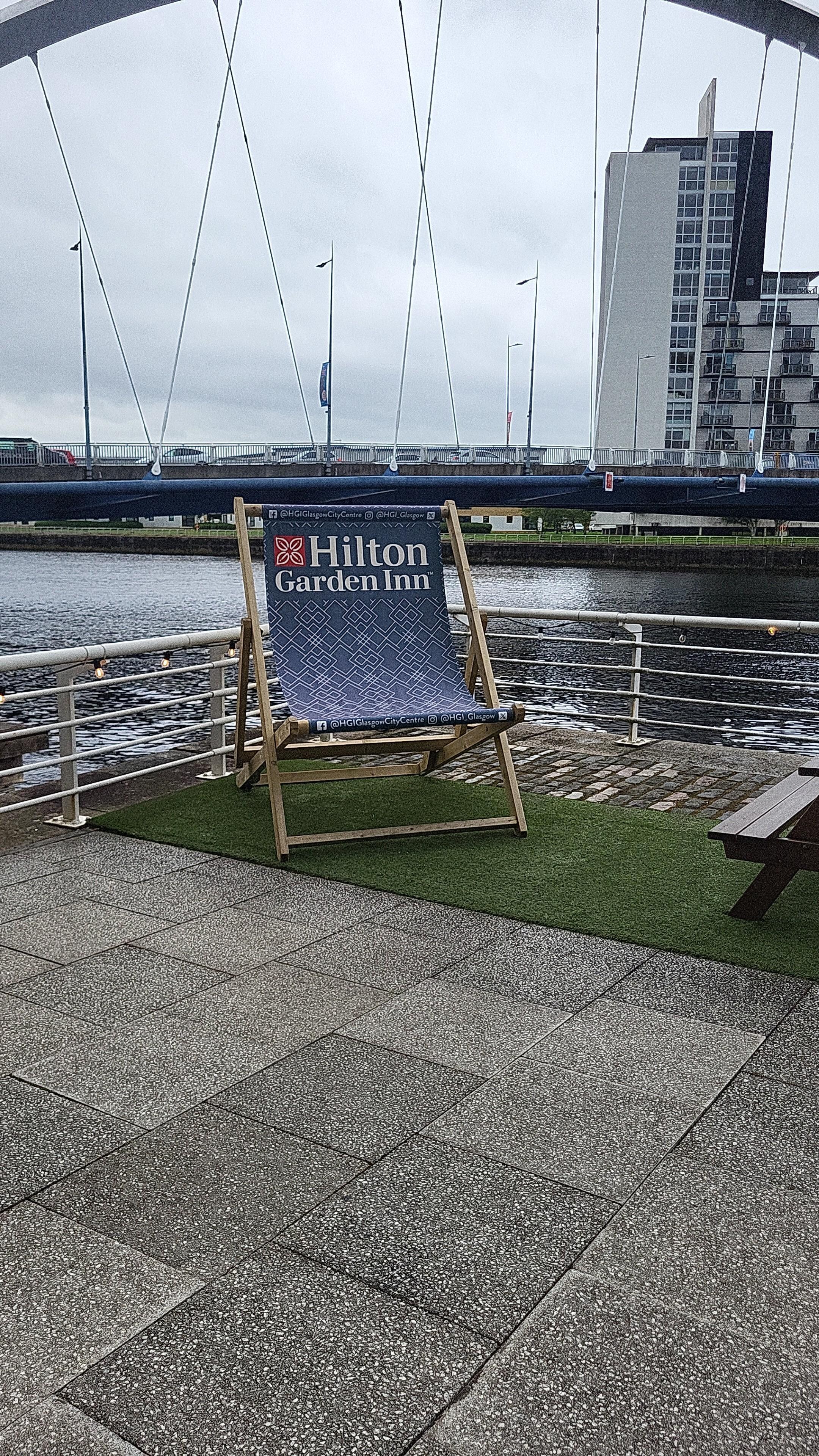 Back of hotel.  Plenty of seating.  Just loved the big deck chair 