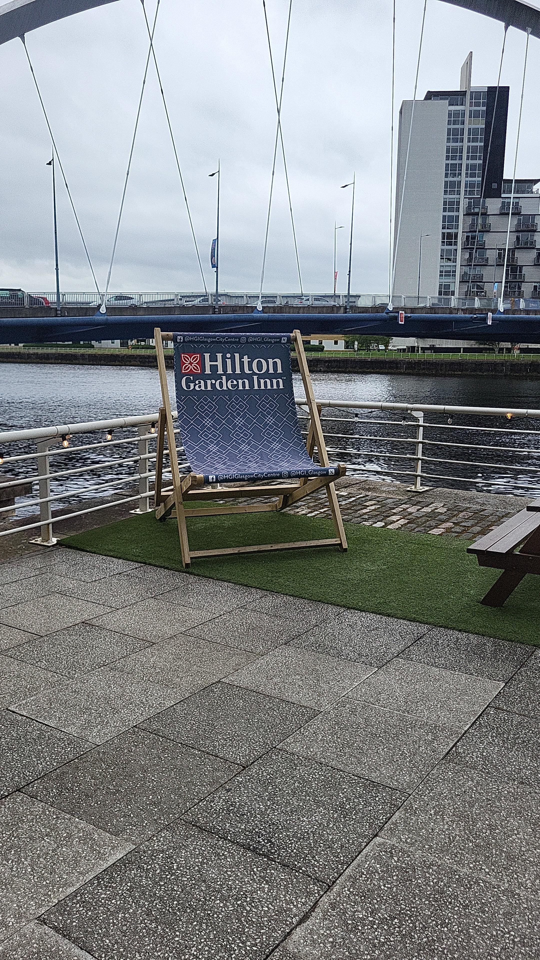 Back of hotel. Plenty of seating. Just loved the big deck chair