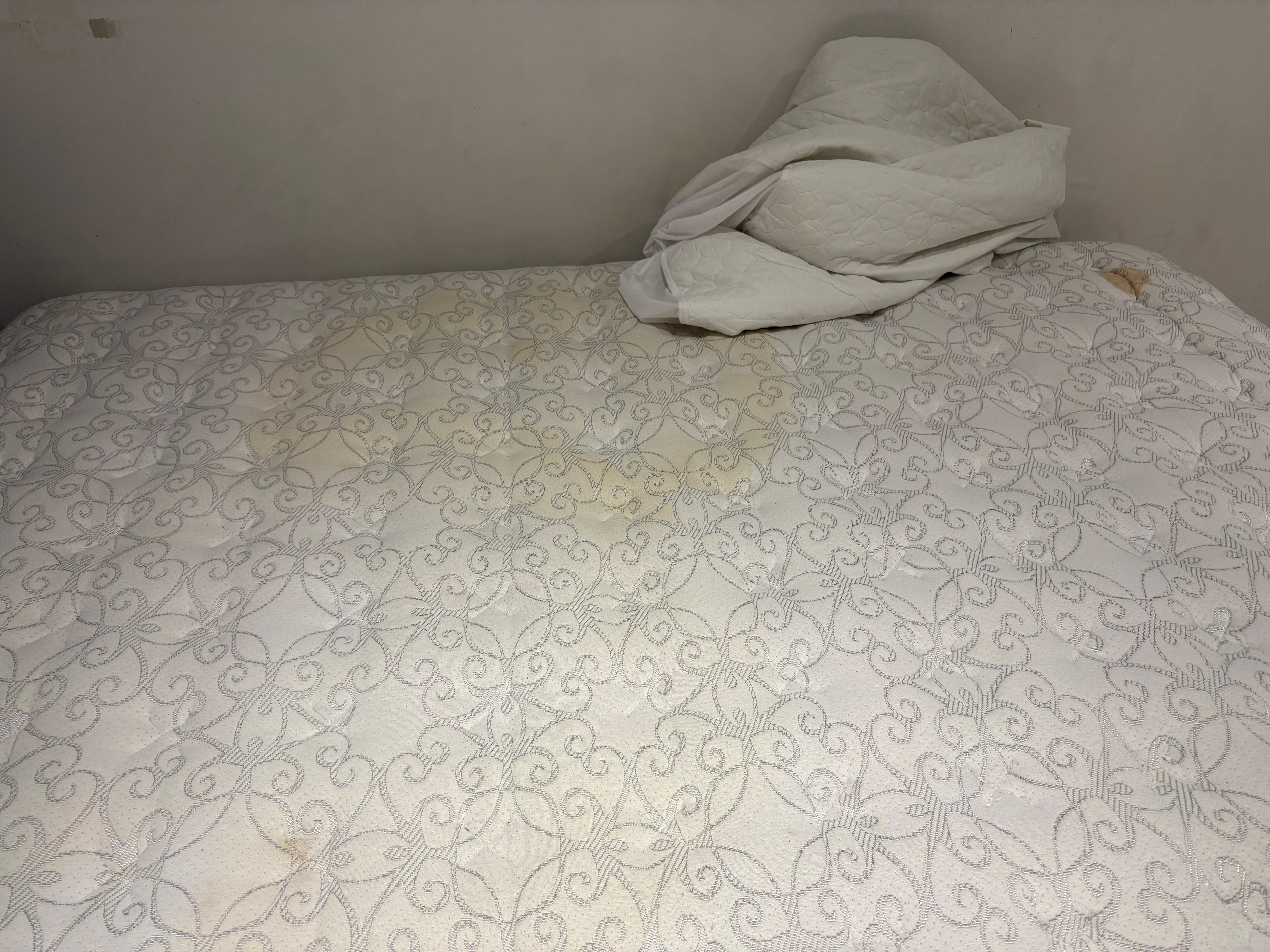 Soiled mattress. You can tell it’s not new