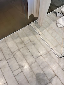 Cracked and broken bathroom tiles