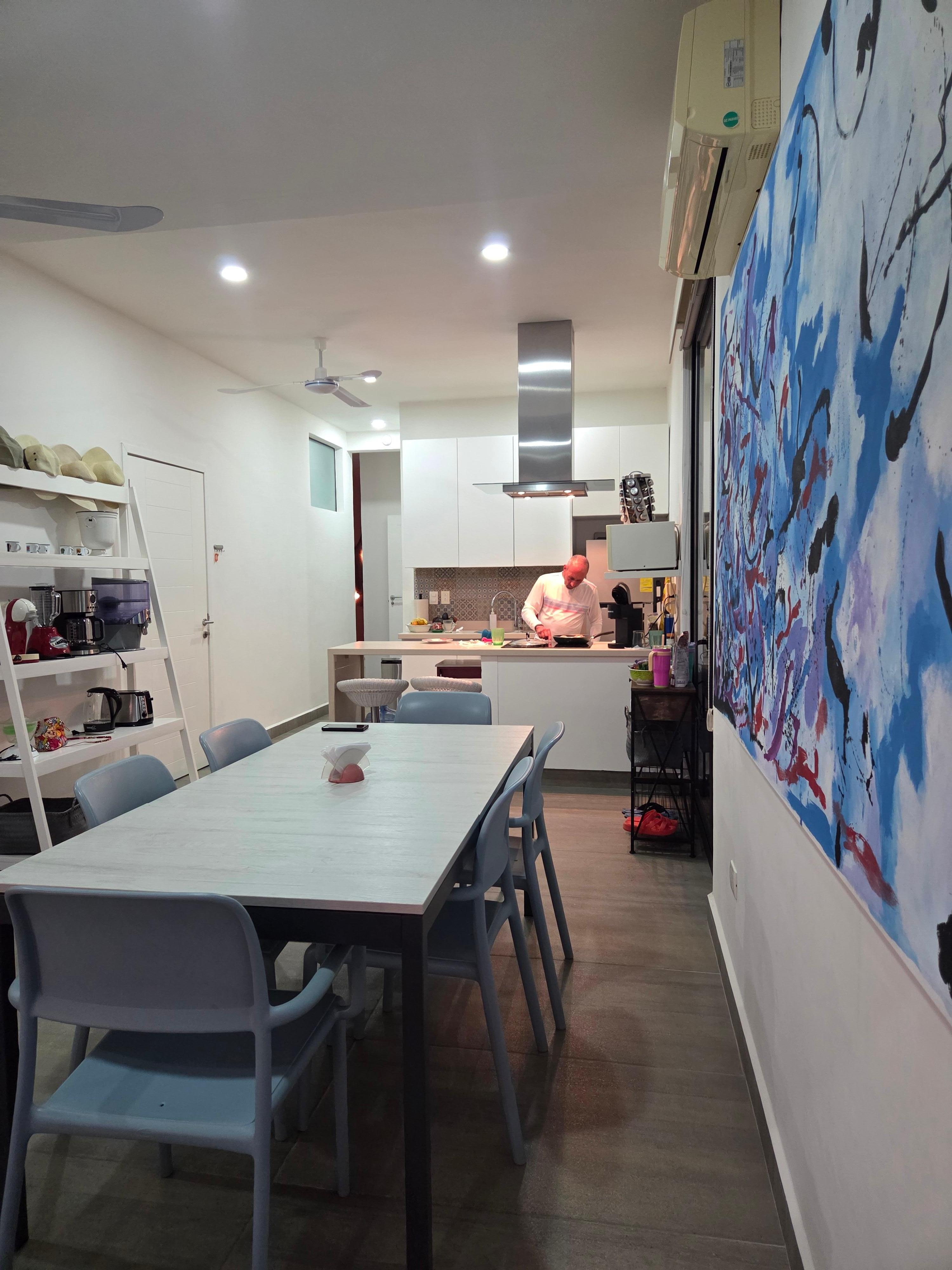 The kitchen and dinning room is open space high ceilings 