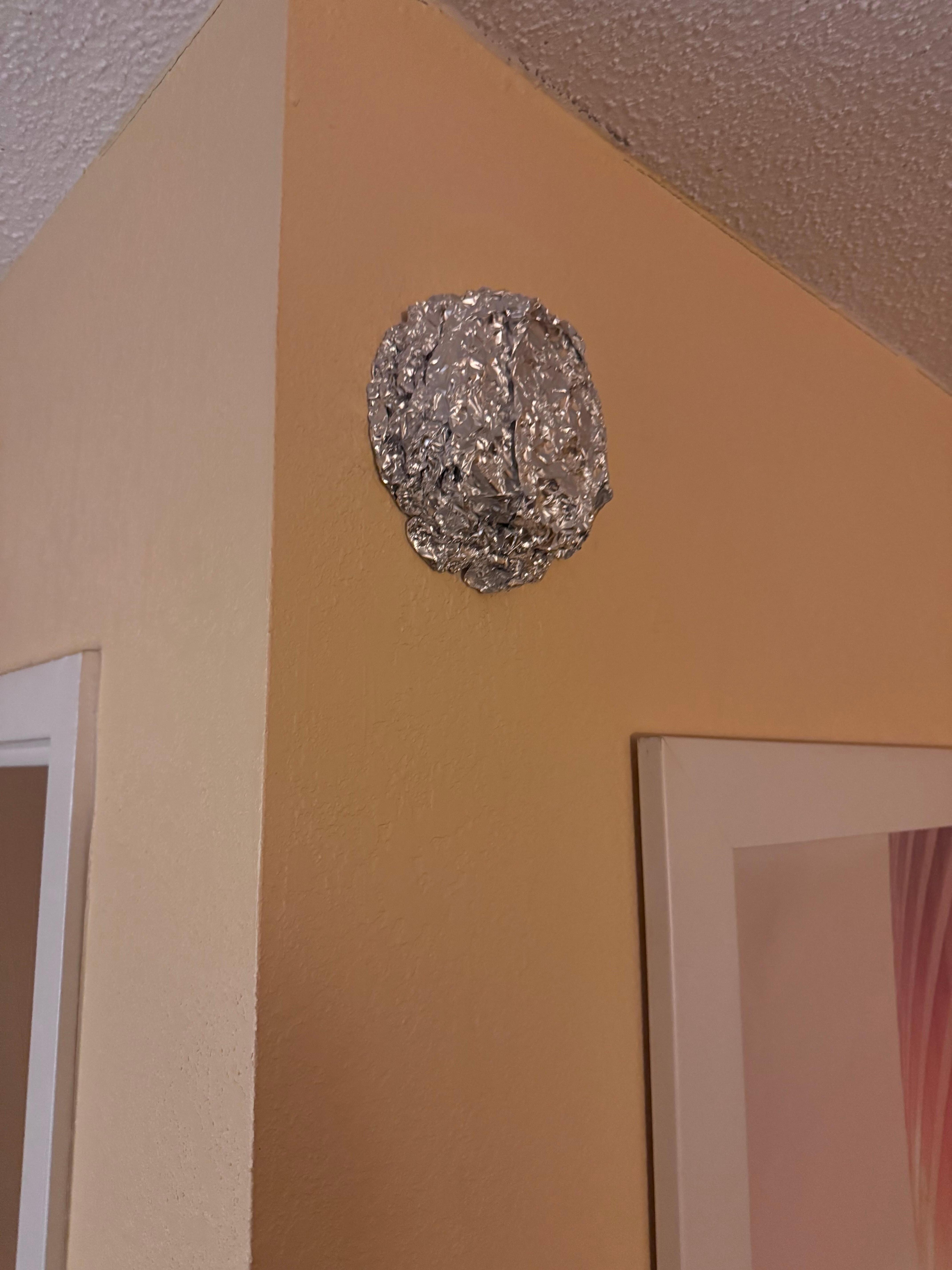 Tin foil over smoke detector
