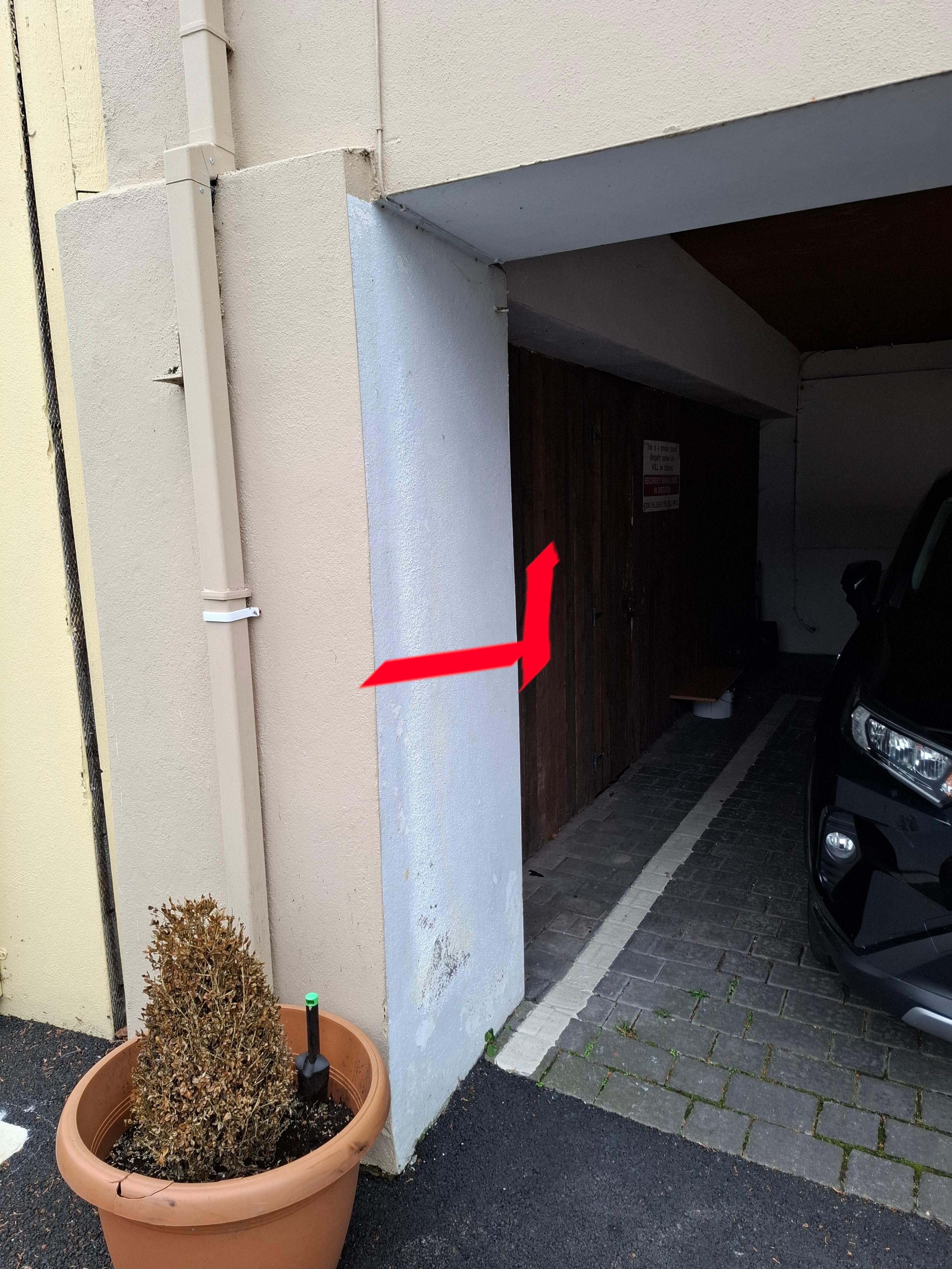 The view from outside the parking area with the route to the key highlighted in red. The safe is concealed around the corner & not immediately visibleon the lefthand wall as in the description, particularly if there is a car parked there.