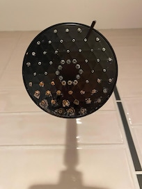 Shower head in bathroom.