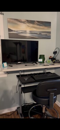 There's a nice workstation available in the corner of the living room.