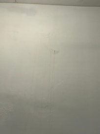 The wall dripping with water
