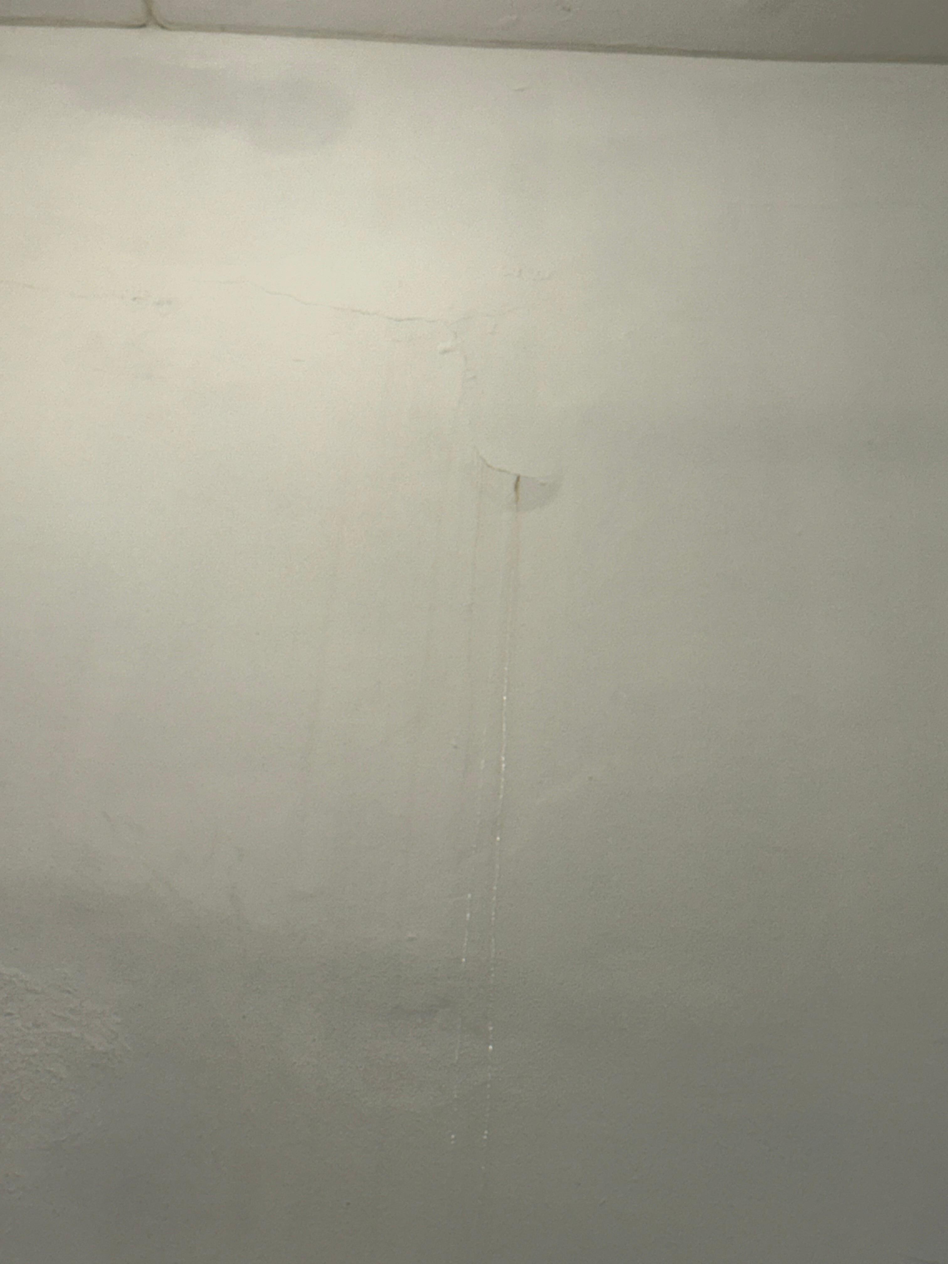 The wall dripping with water