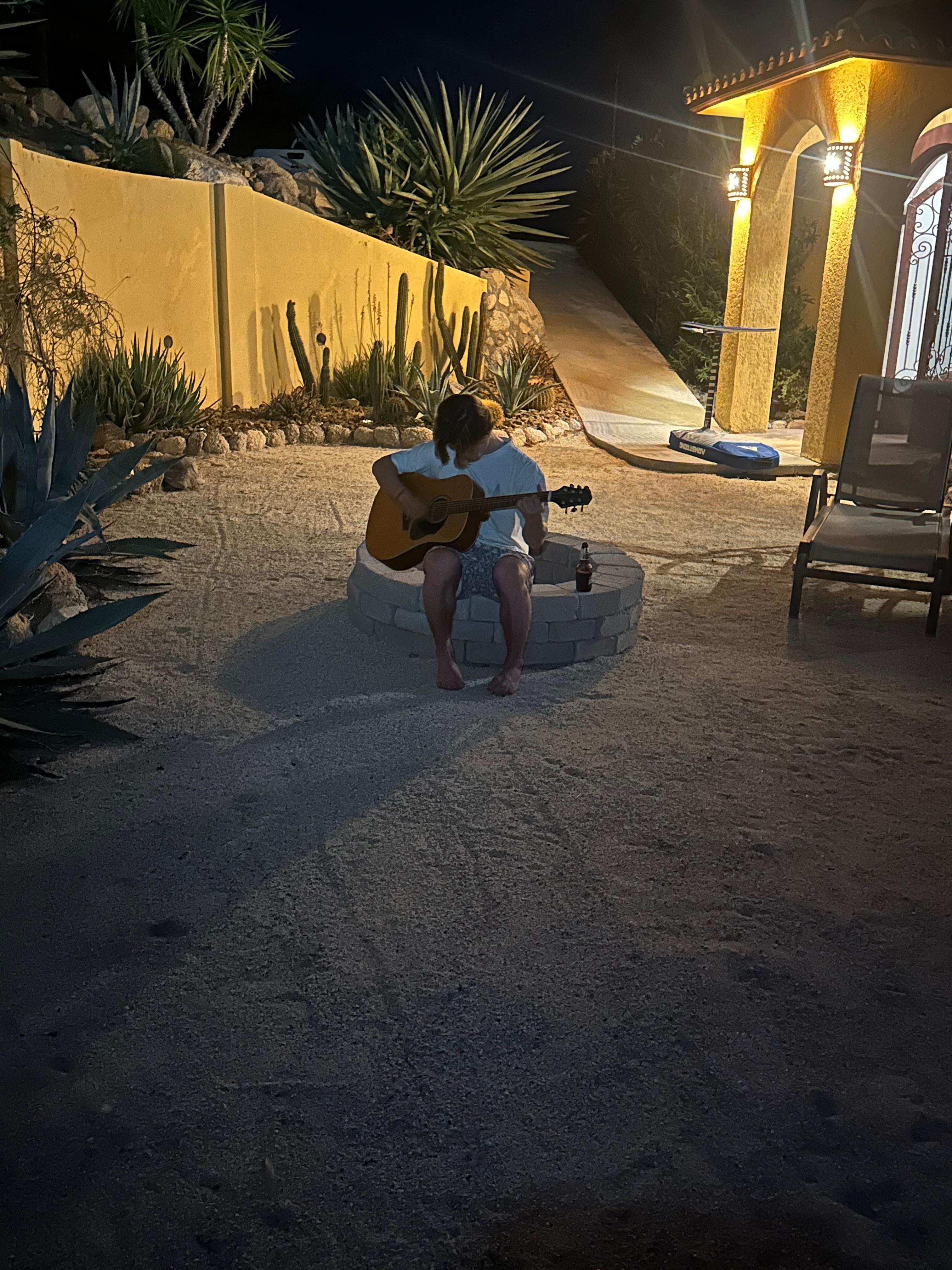 The space with the firepit, grill and pizza over is sublime