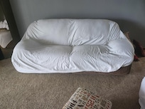 Couch dirty had to cover with a sheet