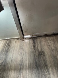 Opening at bottom of door leading to outside