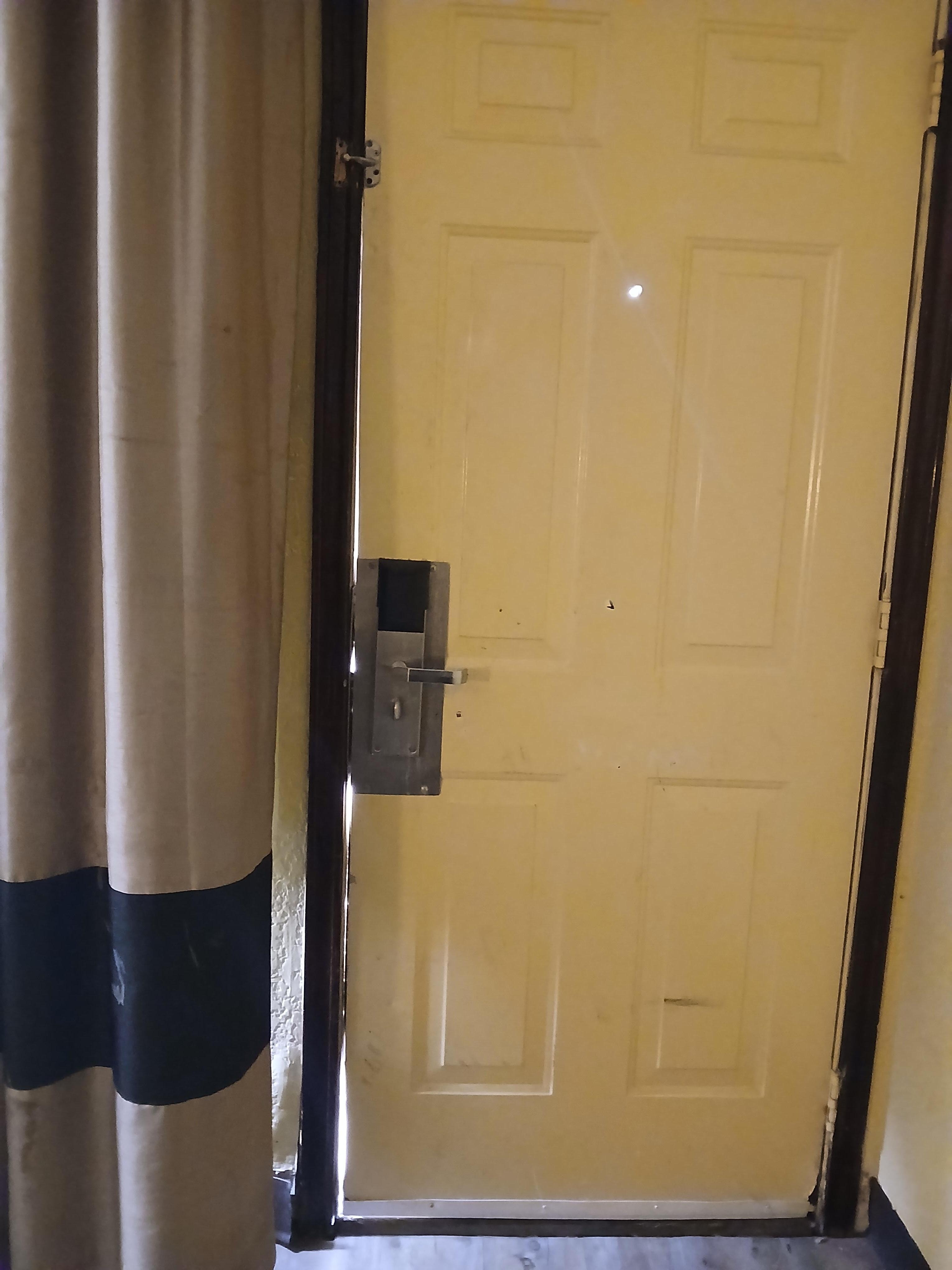 See all the light coming in around door ( and was 37 outside) top security lock was broke off.