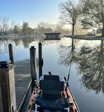 My kayak tied to the boat dock in the rear of the house.
