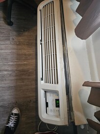 Ac unit held together by packaging tape