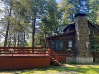 Surrounded by tall evergreens