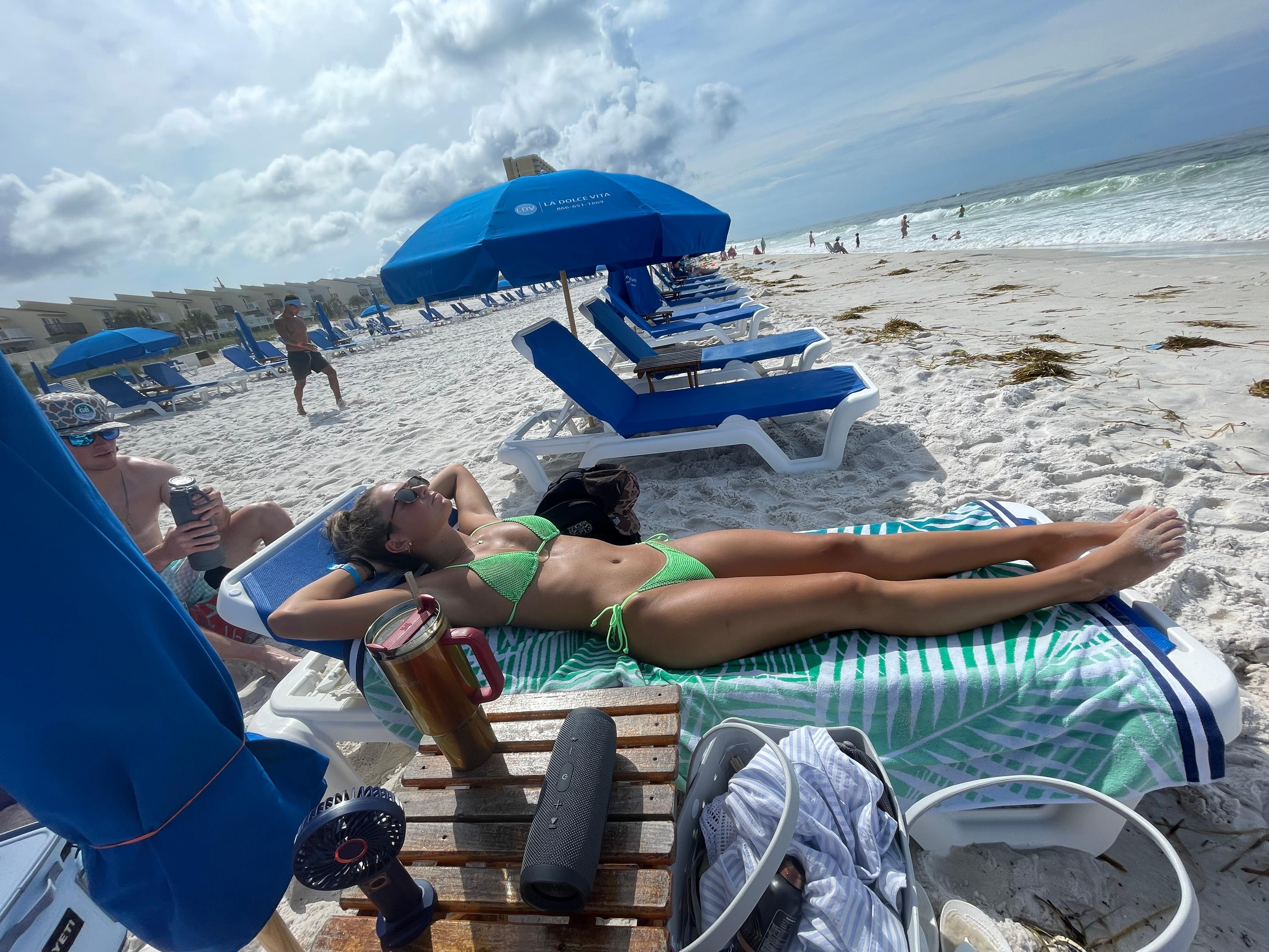 Nice Beach chair set up! 2chairs, an umbrella and a small table included with stay!
