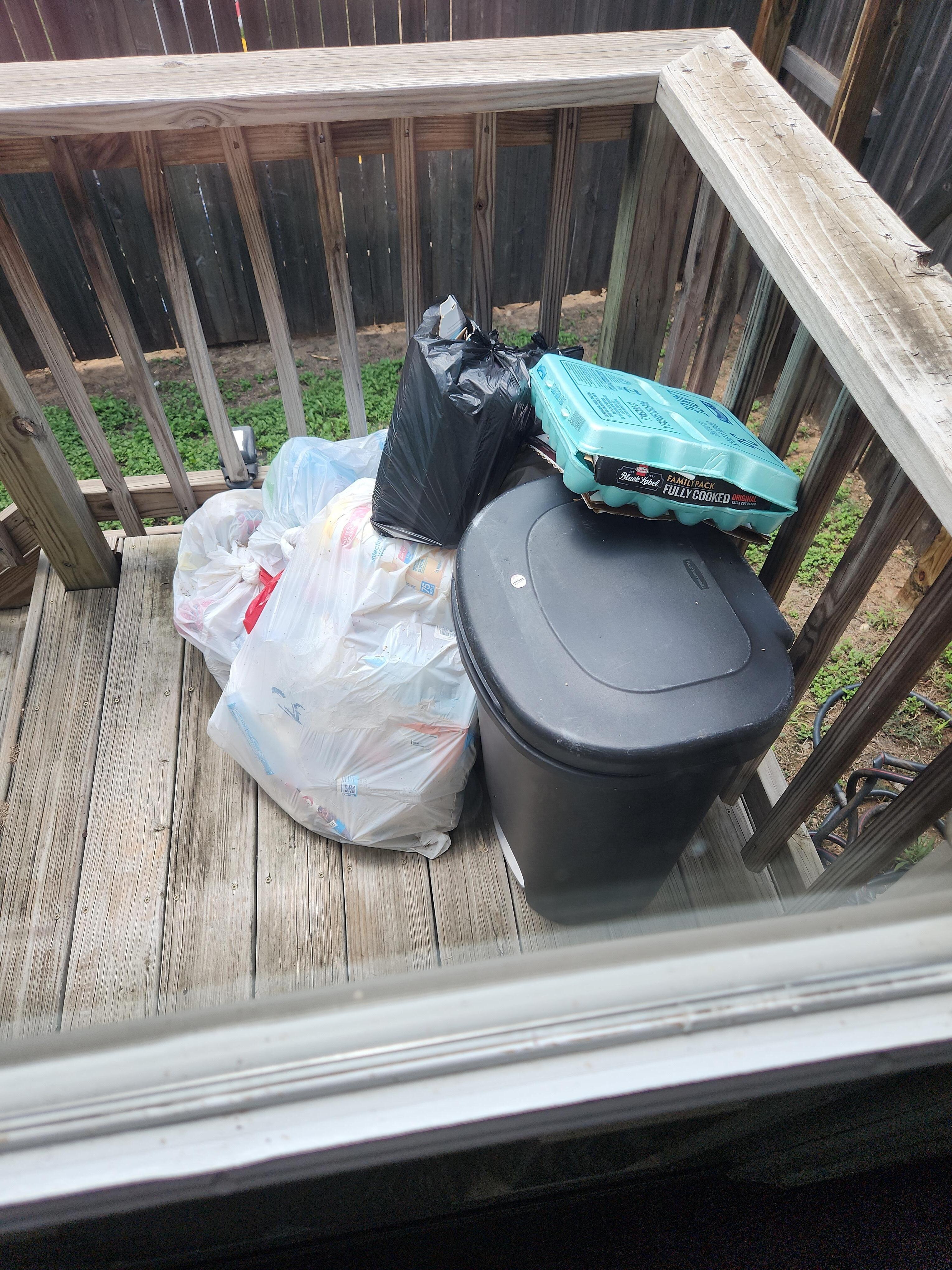 This trash had been there a few days and was swarming with flies. This door is DIRECTLY off the kitchen