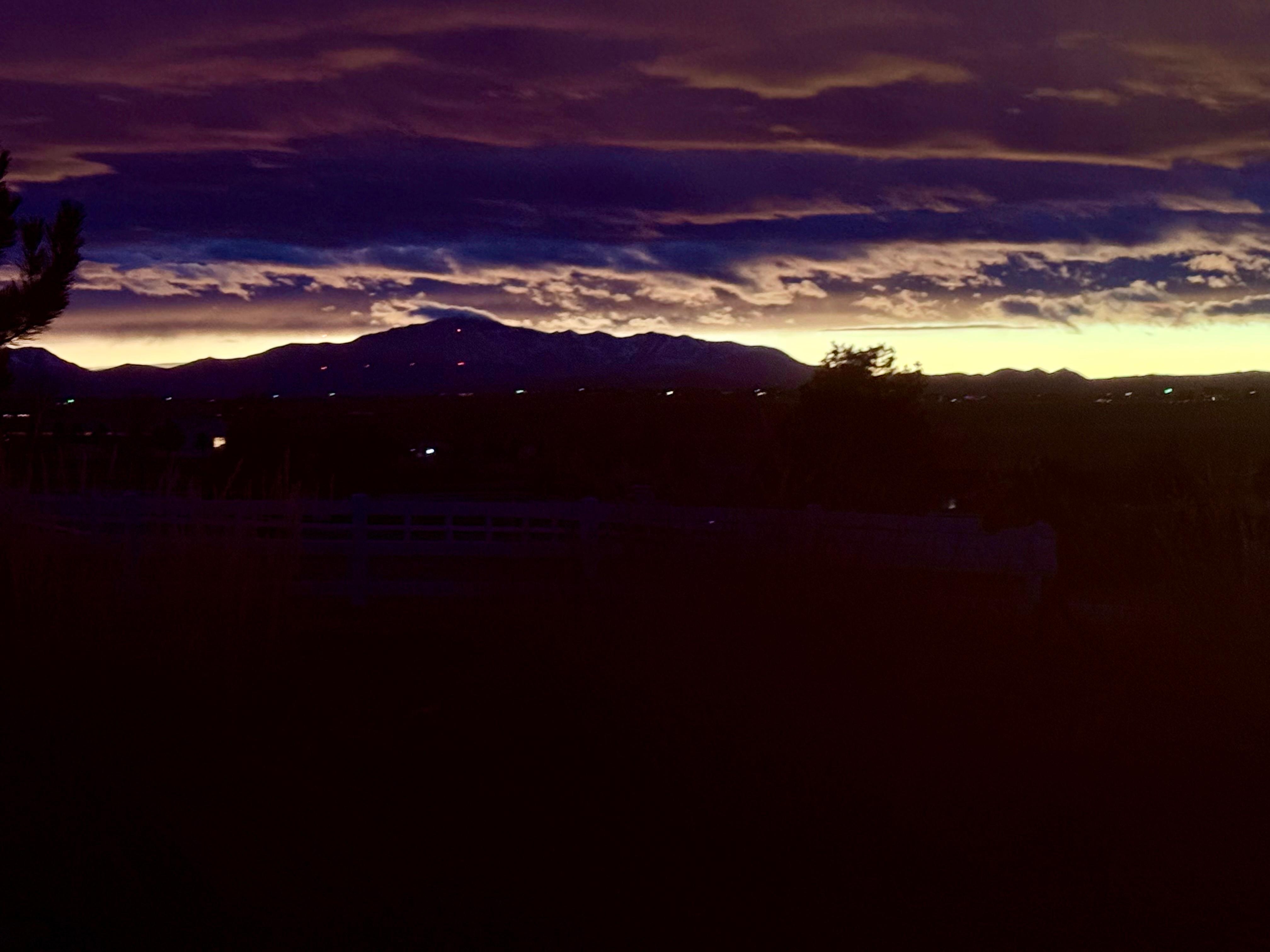 Sunset view with clouds over Pikes Peak
