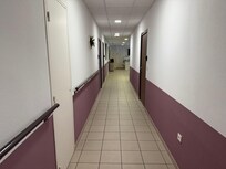 Corridor outside the room.