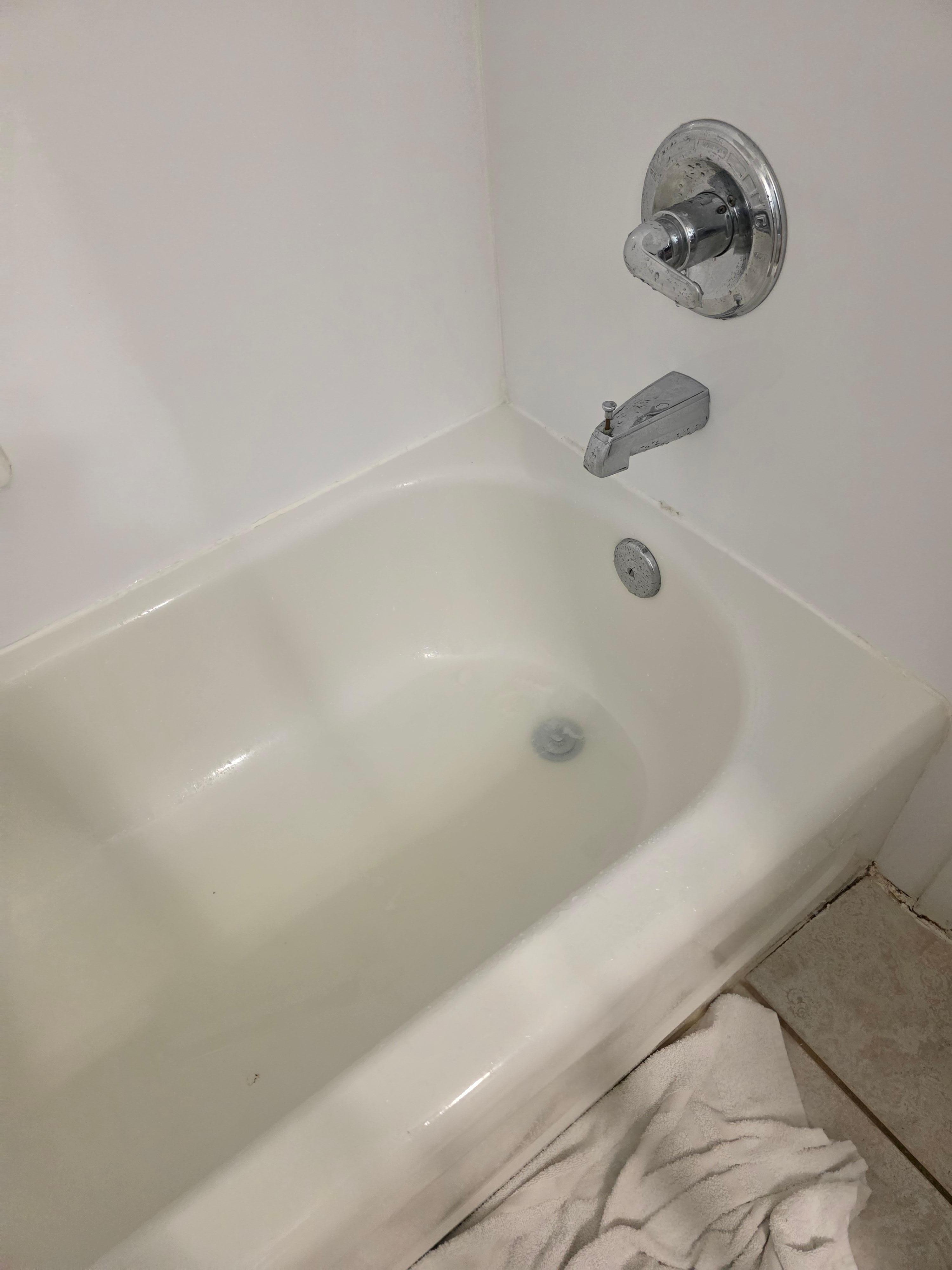 Dirty stained bathtub