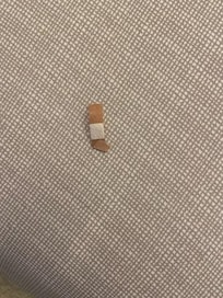 Bandail found in king bed as we were re-making it because the top sheet was placed under the fitted sheet. All of the bedspreads had stains on them.