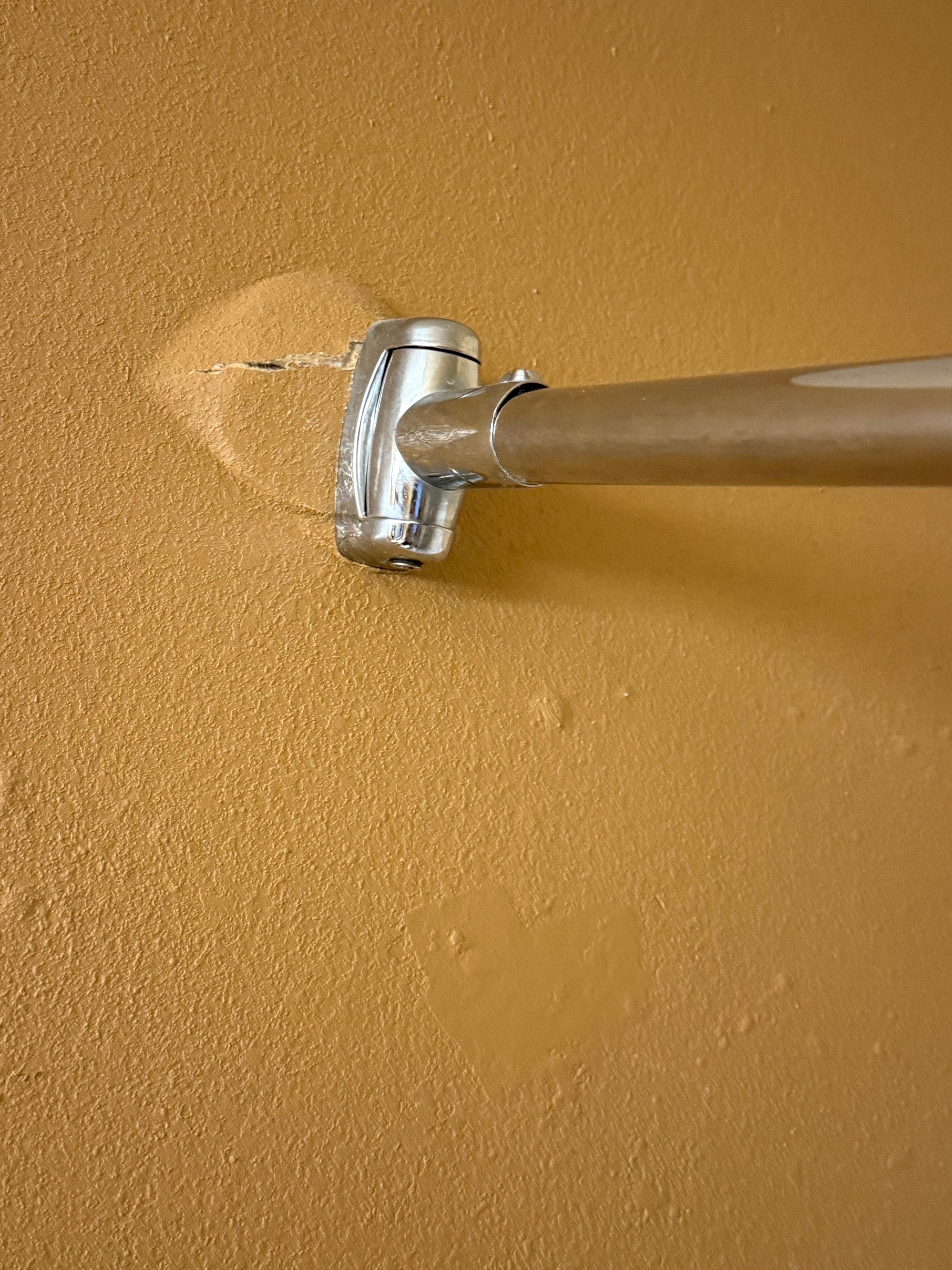 Picture of the shower curtain rod that almost hit me in the head. 