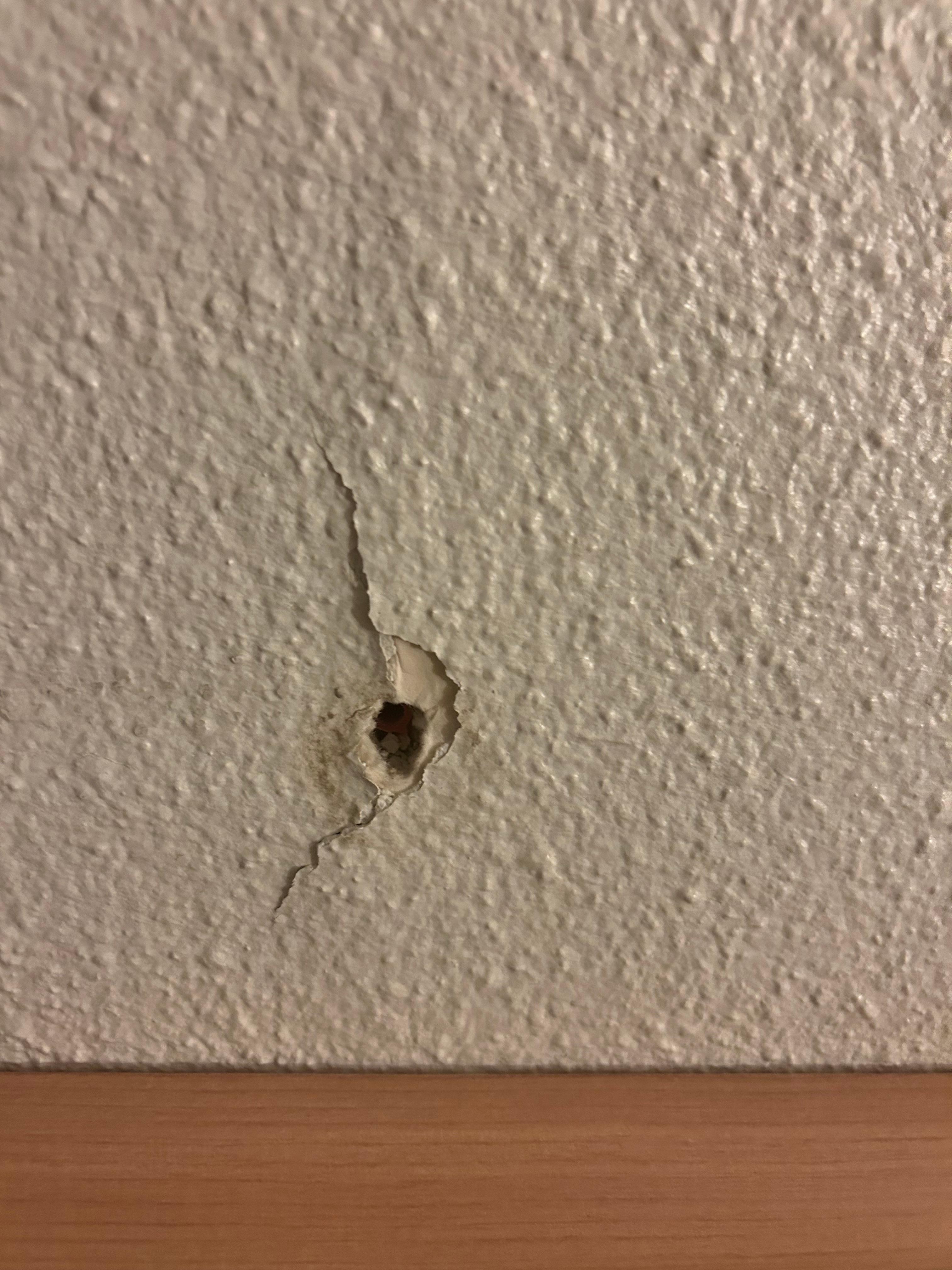 Hole in the wall from the door