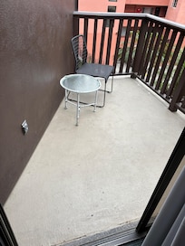 Our balcony missing a chair and not enough chairs even inside for us all to sit down together as a family.