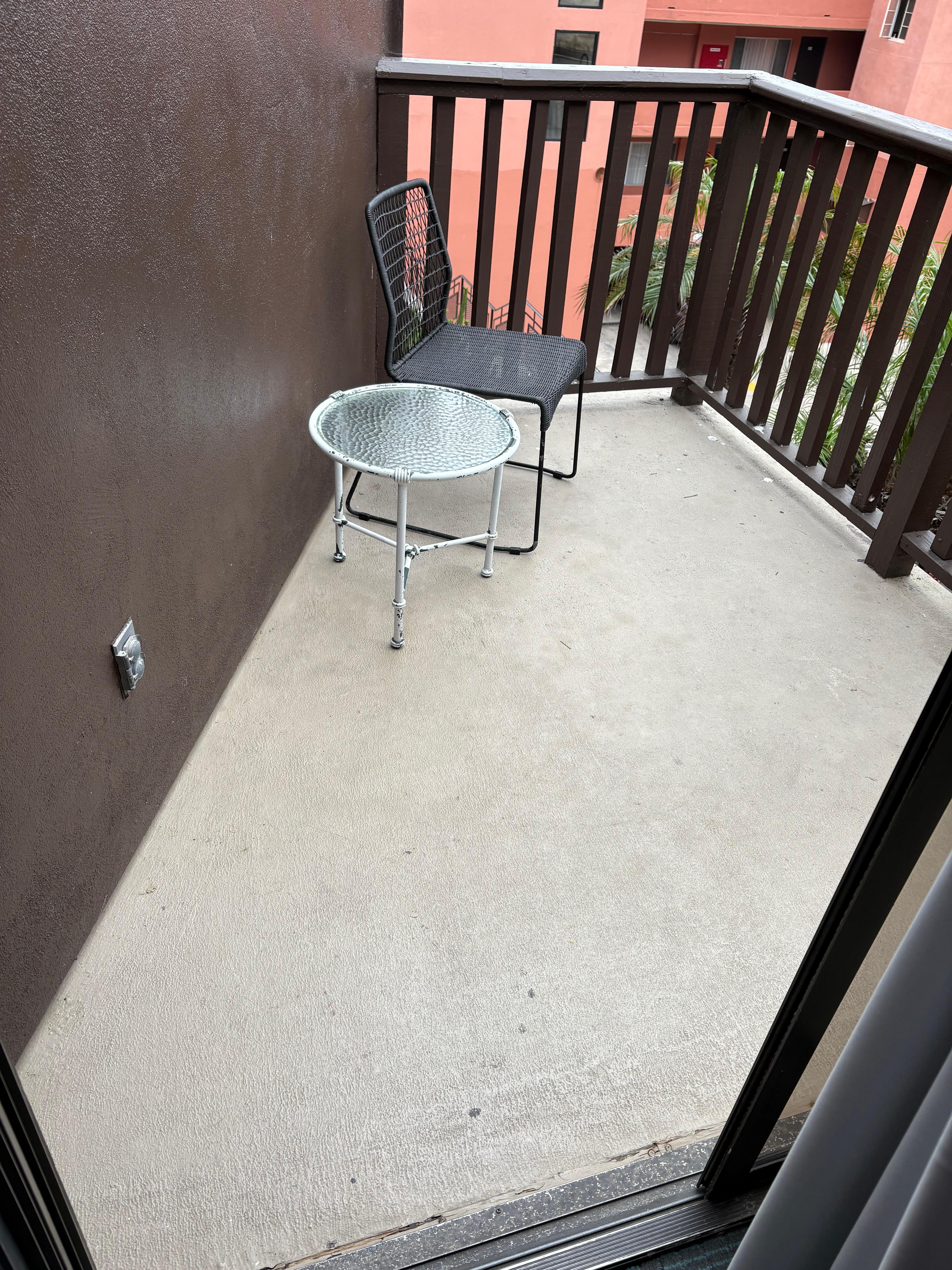 Our balcony missing a chair and not enough chairs even inside for us all to sit down together as a family.