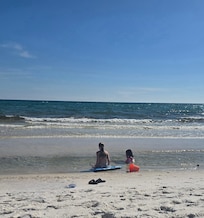2 of our littlest enjoying the surf