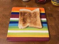 Either burns the toast or toasts one side only.
