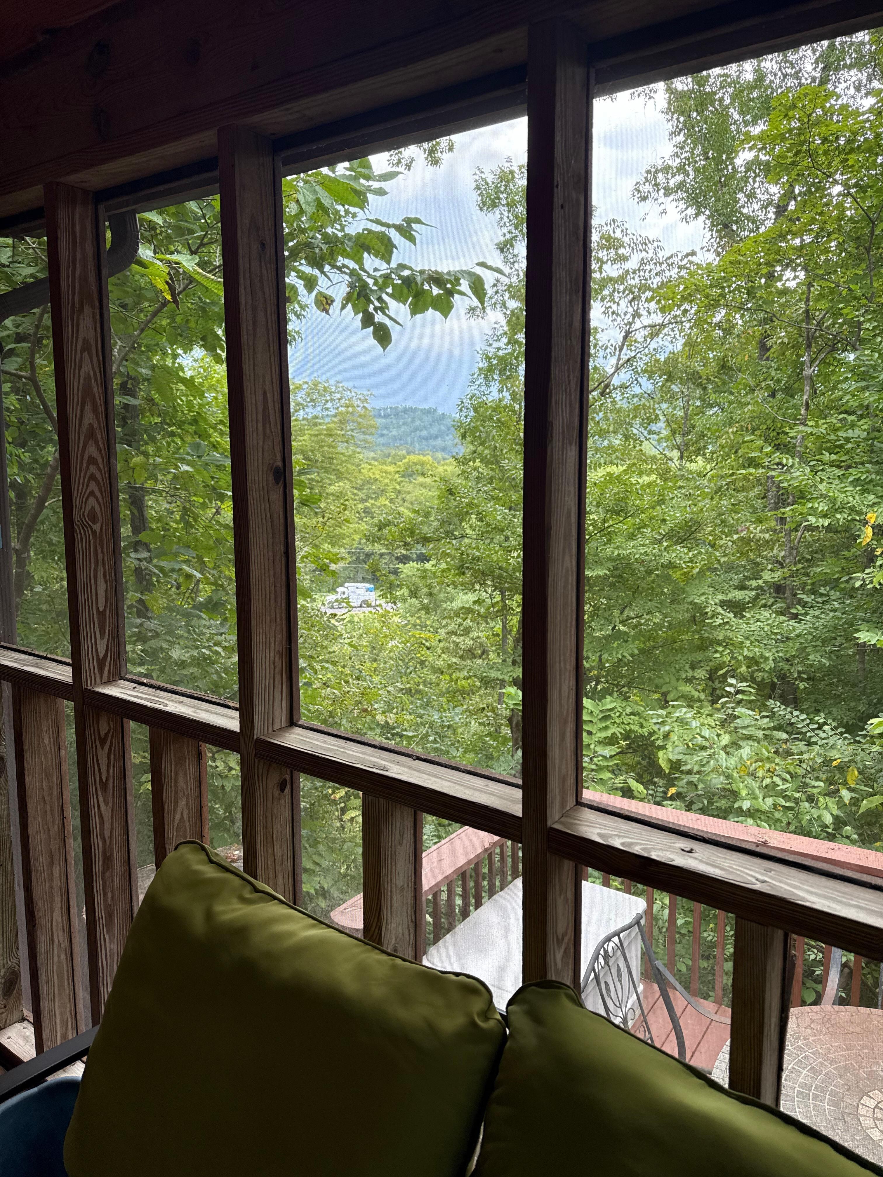 Front Porch View, has screened in porch, hot tub, outside dining